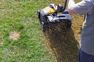 depositphotos 206769662 stock photo aeration of the lawn in